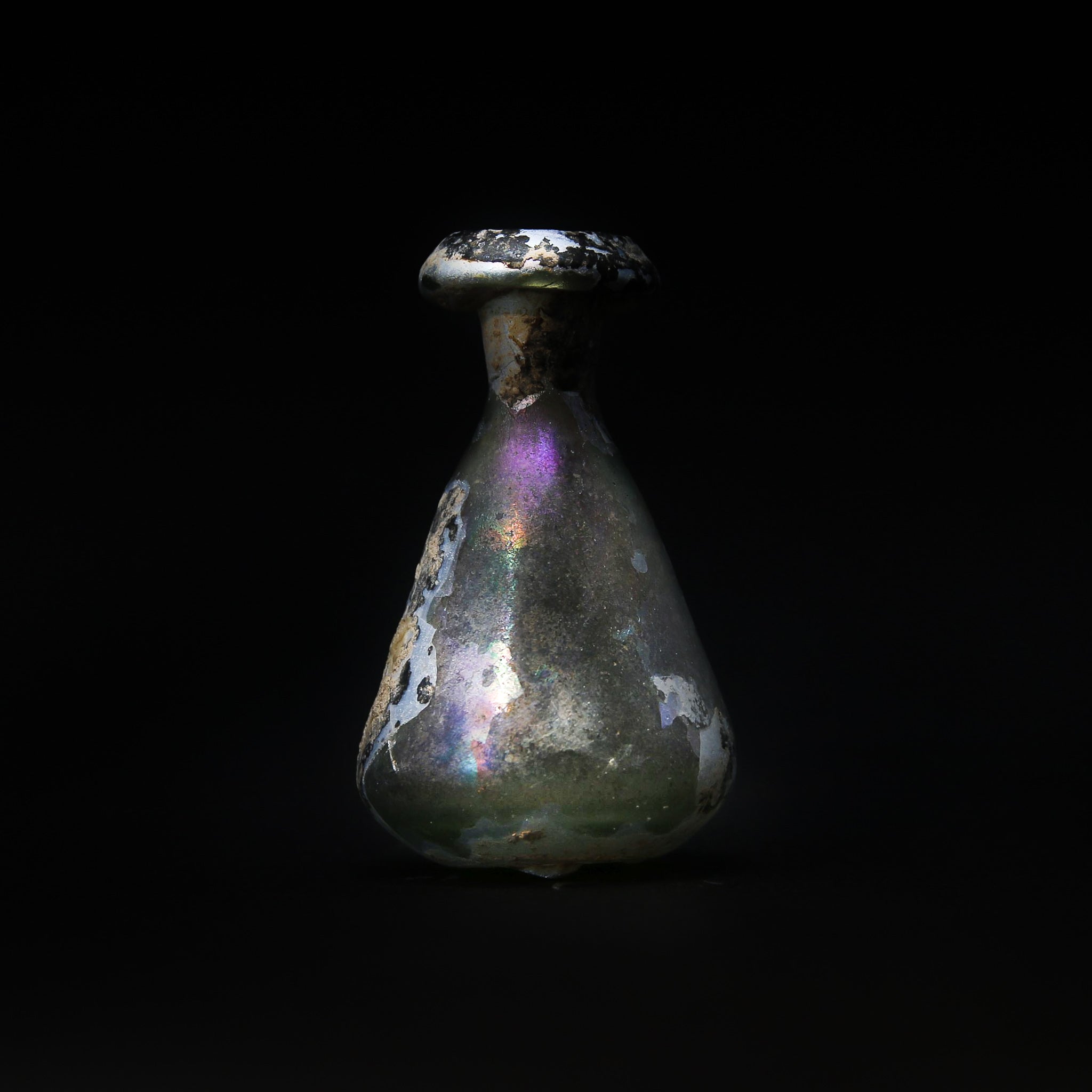 A Roman Iridescent Glass Bottle | 3rd-4th century AD