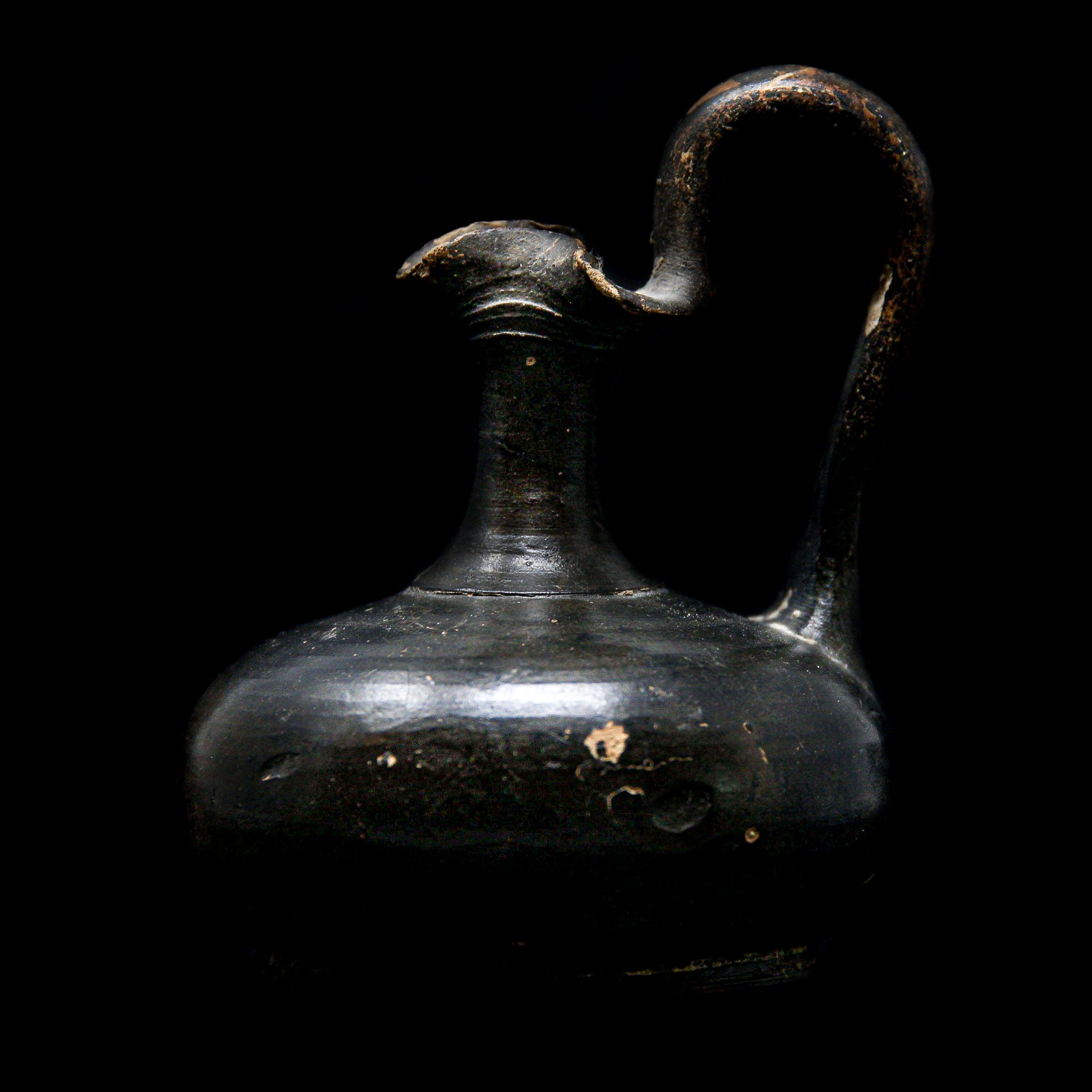 A Greek pottery black glazed jug | Greek, 4th Century BC